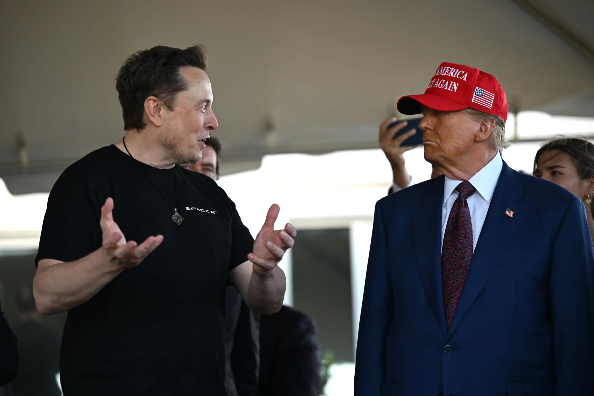 elon patiently explaing how things work to donald trump